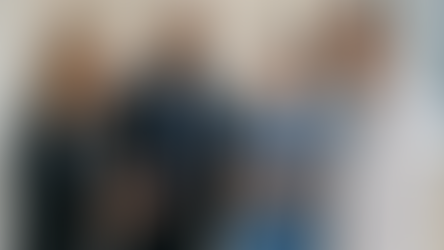 A team of healthcare executives and frontline workers engaged in a collaborative conversation