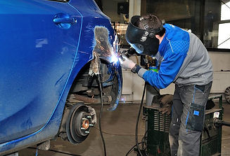 MIG welding an auto body.jpg