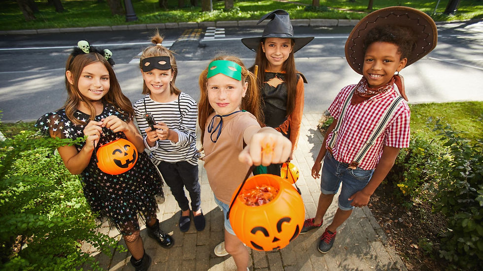 group of kids in halloween costumes doing trick or treat for outdoor activity