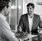 Two men discussion / negotiating documentation