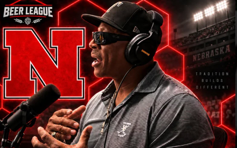 Keithan McCant #43 speaks into a mic in a studio-style Nebraska graphic, with a red N, headset, and Beer League logo.