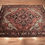 Thumbnail: Persian Heriz rug 6'7" x 9'11",hand-knotted,wool,geometric design, central medallion, reds, blues, and ivories,