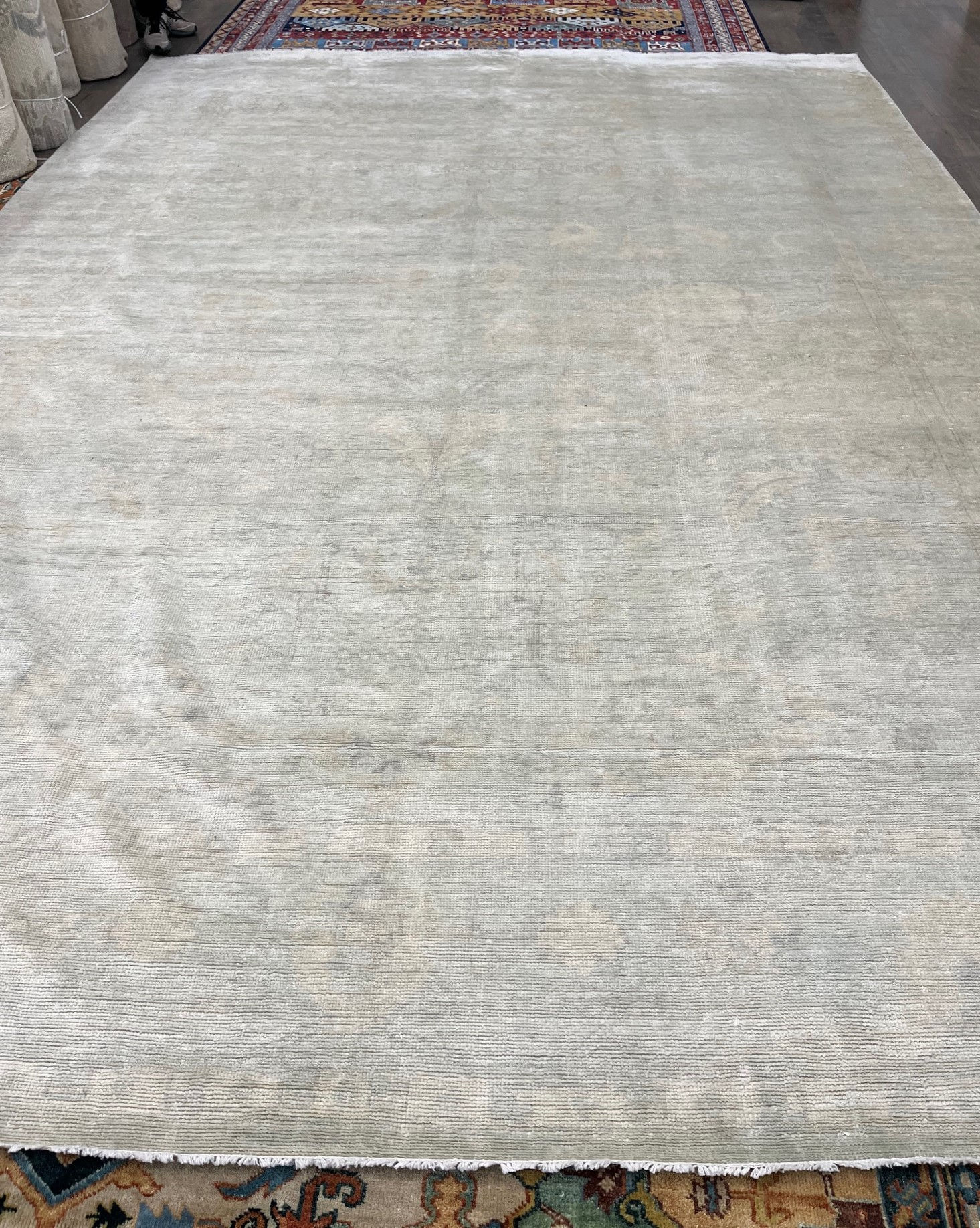 10' x 14' Indian Oushak Rug at Persian Gallery. This exquisite piece is hand woven, wool pile and a durable cotton foundation