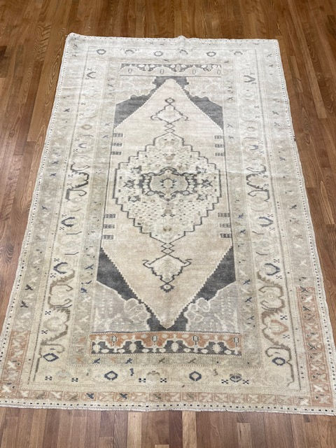 Turkish Oushak Rug, measuring 5'1" x 7'9". Hand woven with a luxurious blend of wool and cotton,