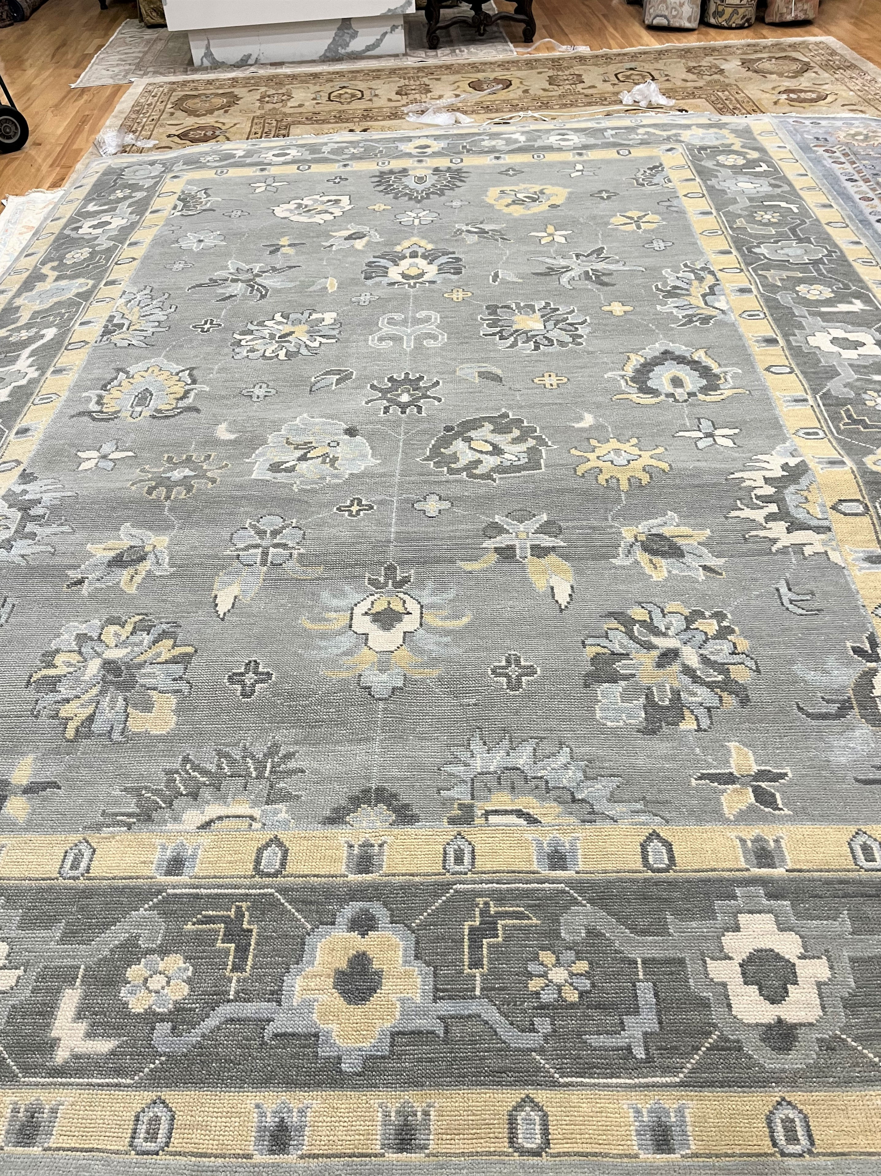 India Oushak Rug 10'2" x 13'10", a hand-woven, wool pile and cotton foundation.