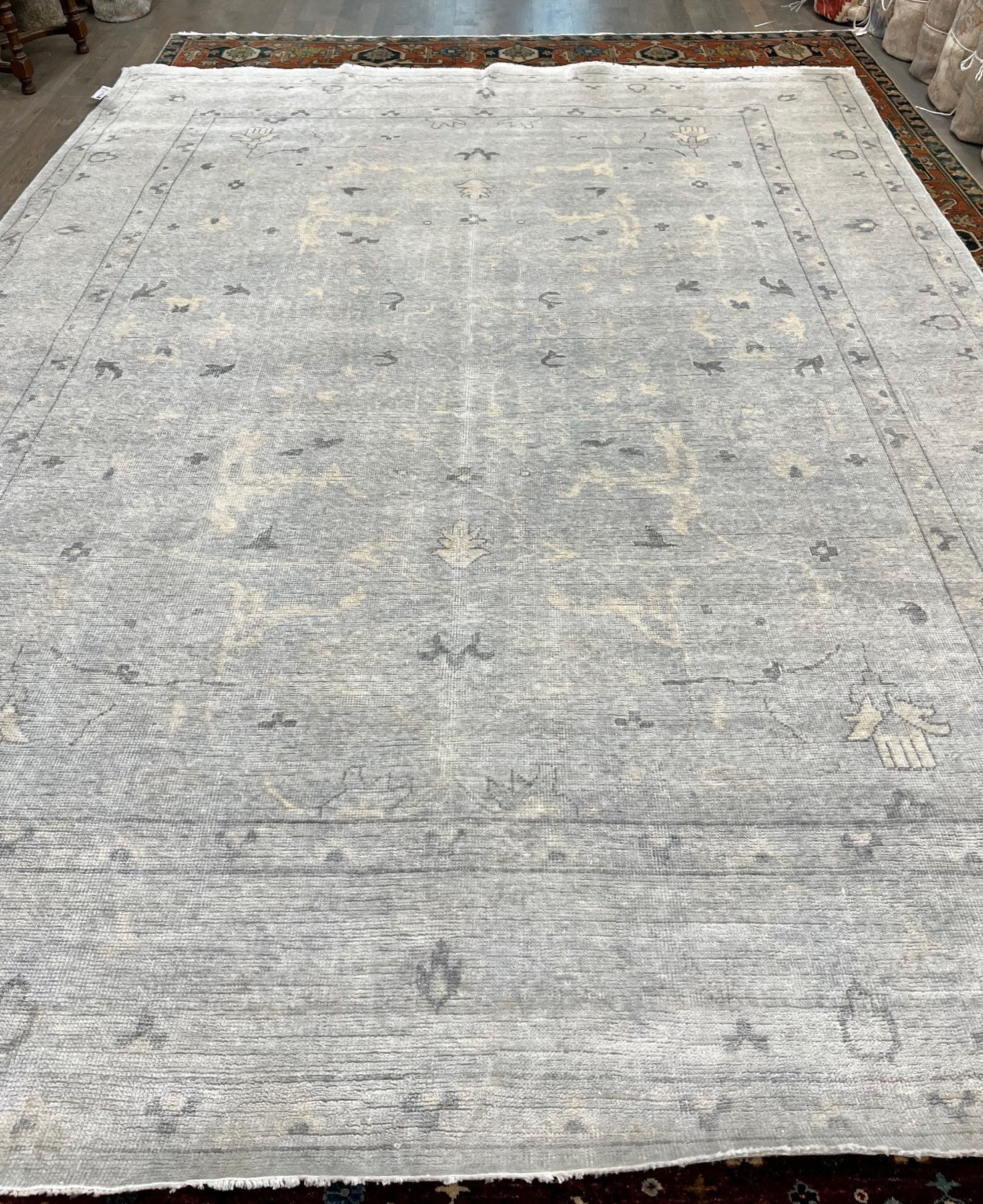 hand-woven India Oushak Rug in a spacious 9' x 12' size,wool pile and durable cotton foundation.