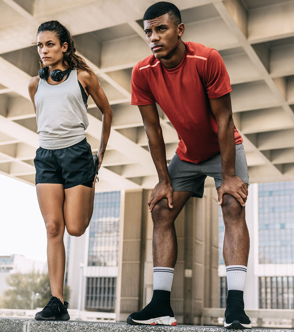 man and woman stretching and preparing to begin a workout