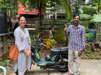 Navneet Roopra presents Charles from Asha Niketan with a motorcycle donated by OWC