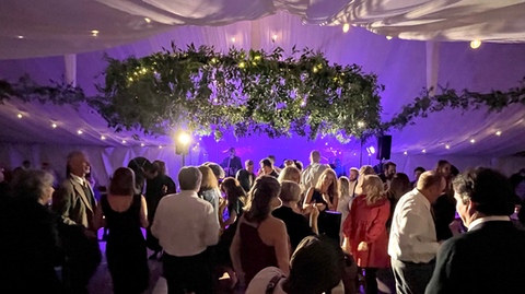 Beautful outdoor wedding under classy decorated tent