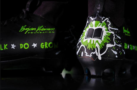 Rear view of Bijan Robinson Bijan Reads custom NFL cleats by Sandi DeMeo