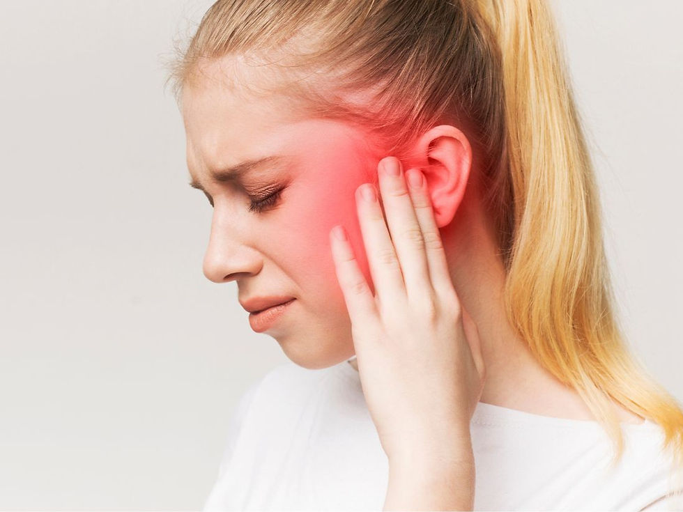 Person pressing their fingers against the TMJ with a red transparent overlay showing pain and discomfort in the jaw.