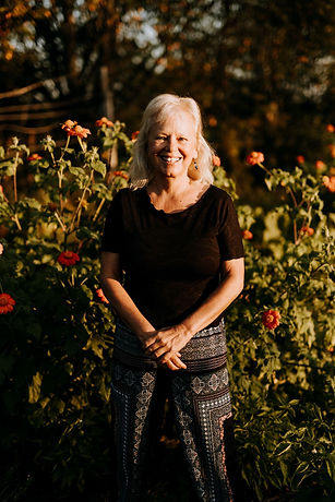 Joan standing mexican flowers 2.jpg