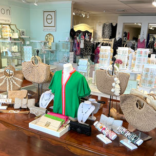 Interior view of Material Girls Boutique in Orange, Connecticut featuring a large selection of enewton design jewelry, women's clothing, accessories, and gifts.