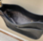 inside view of vegan leather cross-body messenger bag with interchangeable strap