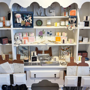 Assorted gifts for the home and baby, including locally made candles from Legrify Inspired.