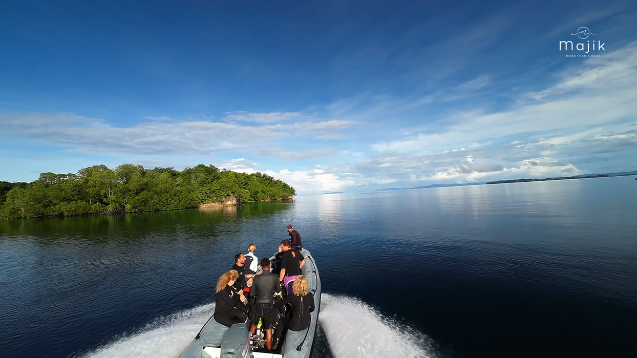 Tender boat with guests exploring lagoons on Majik yacht excursion