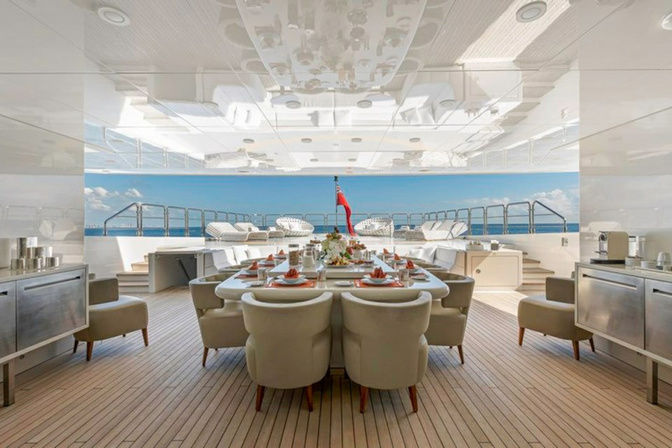 Alfresco dining setup on the aft deck of VICKY superyacht charter