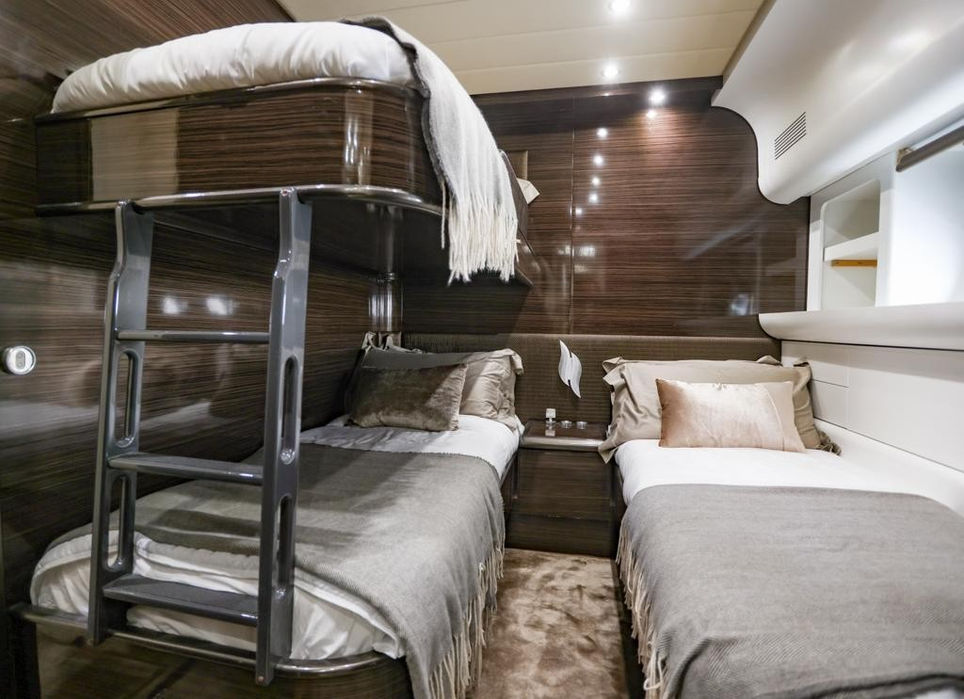 Guest cabin with twin bunk beds and contemporary finishes – Designed for family or group accommodations.