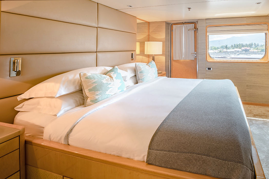 Master suite with ocean view onboard luxury yacht in Indonesia – comfort with yacht charter Indonesia.