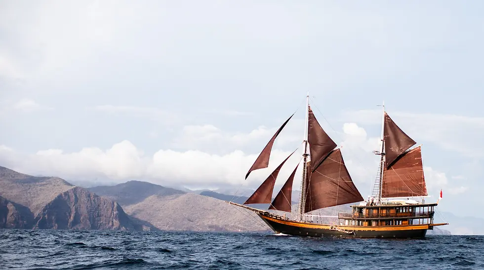 Dunia Baru luxury phinisi yacht sailing in Indonesian waters during a private liveaboard charter in Komodo and Raja Ampat