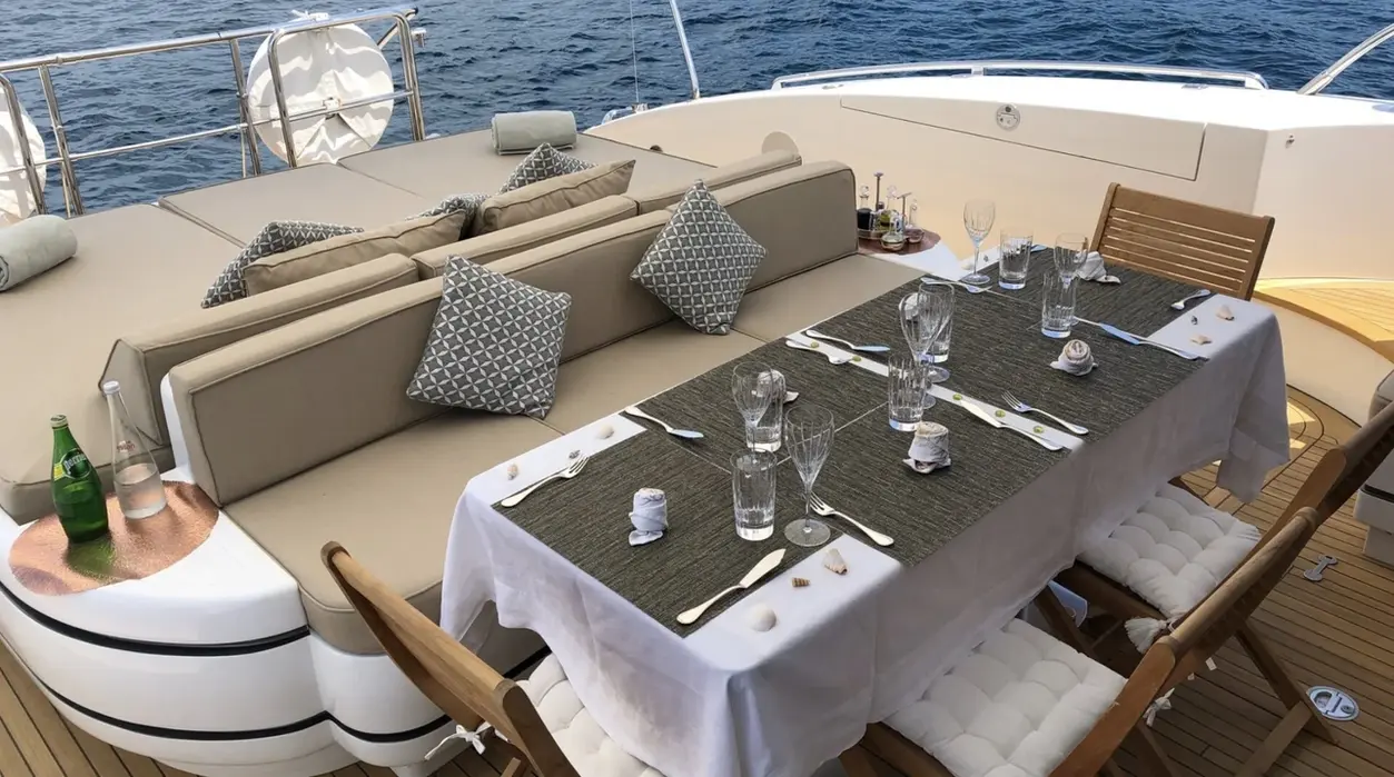 Upper deck dining area with panoramic sea views.