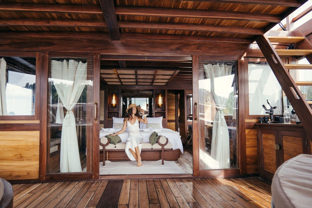Bright indoor dining area with wooden furniture on Senja yacht