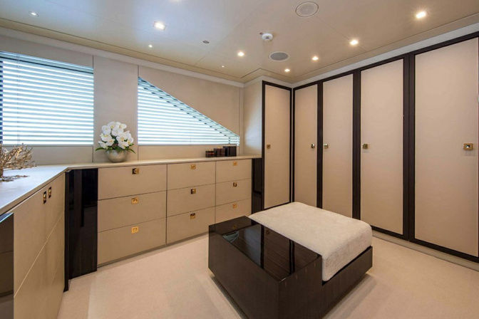 Walk-in closet with modern cabinetry onboard yacht