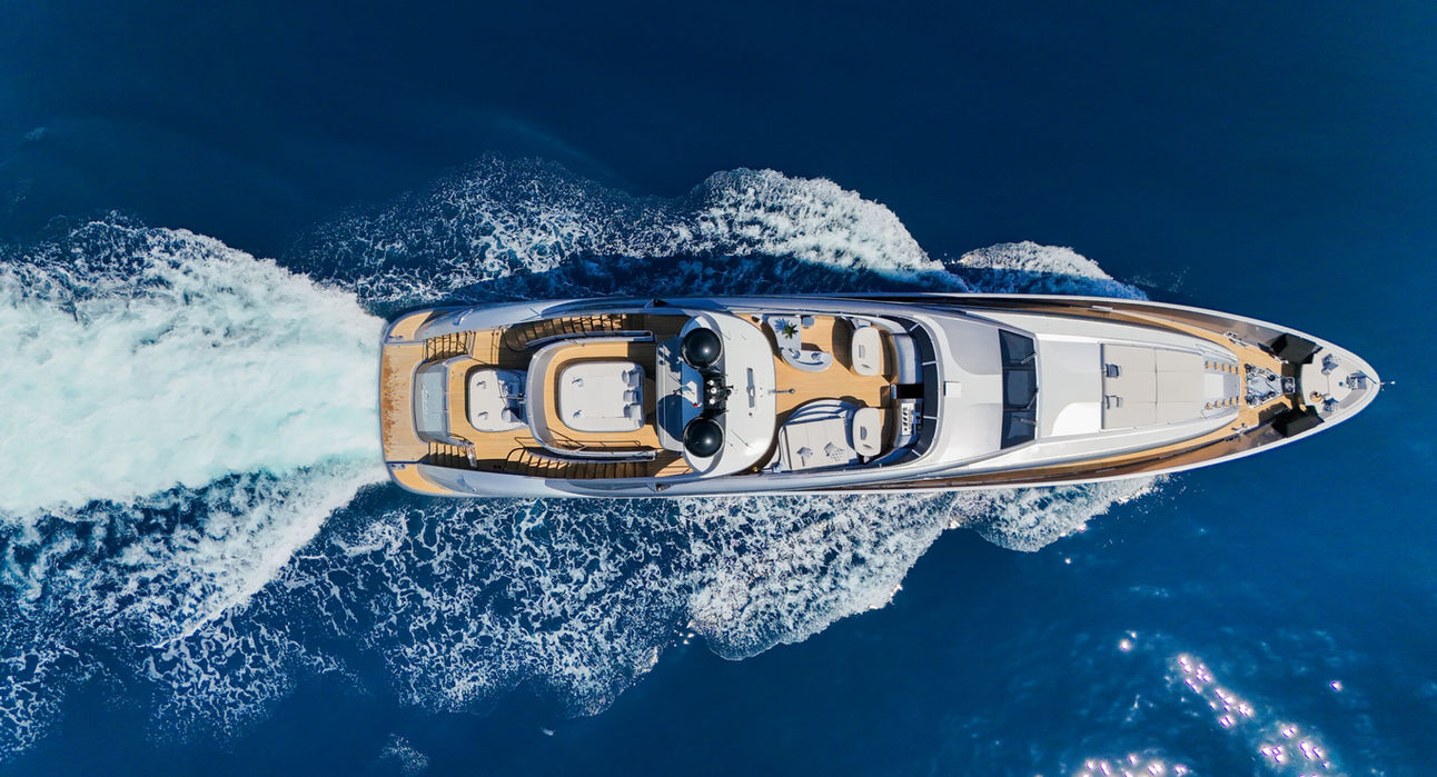 Aerial view of luxury yacht cutting through the sea