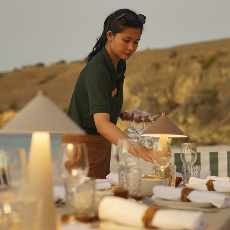 Crew in a luxury Phinisi yacht in Indonesia, representing gratuity etiquette of 10–15 percent for multi-day charters