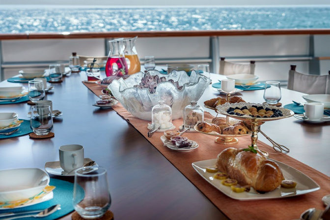 Gourmet dining buffet setup on board a luxury yacht