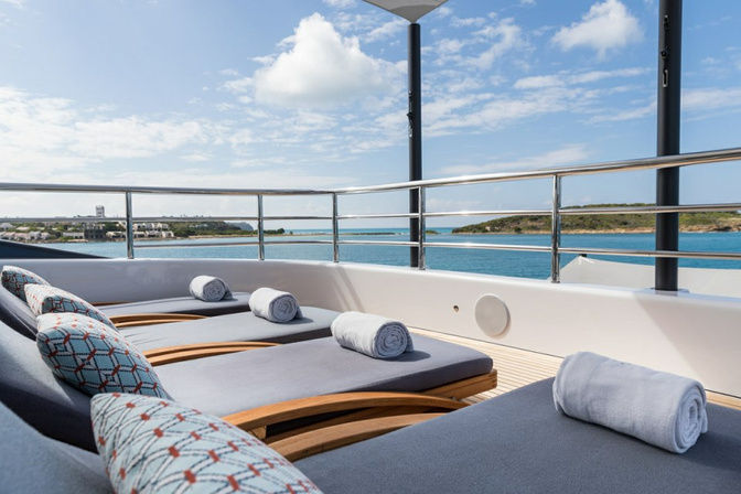 Sunbeds with ocean panorama on Birubi yacht sundeck