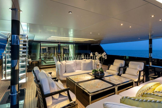 Formal dining table setup inside luxury yacht saloon