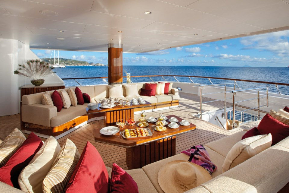 Outdoor lounge with cocktails and panoramic sea views on yacht