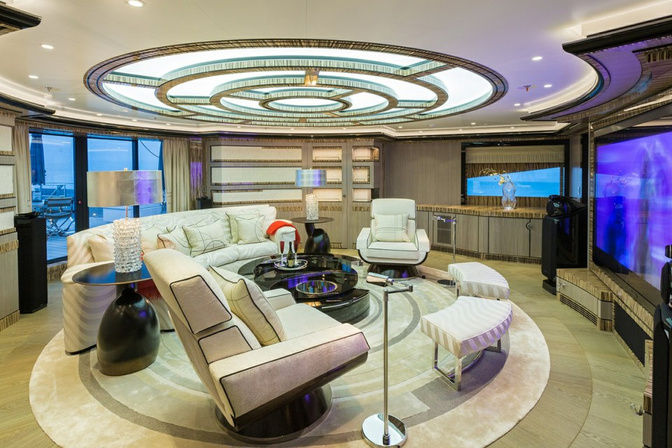 Stylish circular lounge with modern seating on a luxury yacht