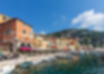 Villefranche-sur-Mer bay yacht charter stop from Monaco with colorful houses