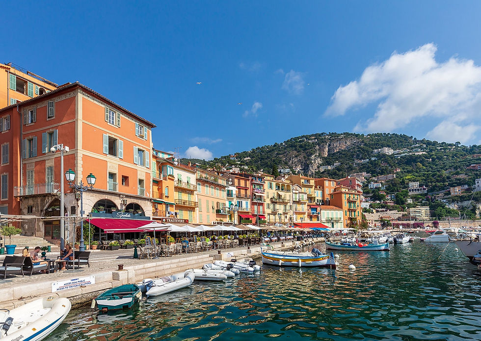 Villefranche-sur-Mer bay yacht charter stop from Monaco with colorful houses