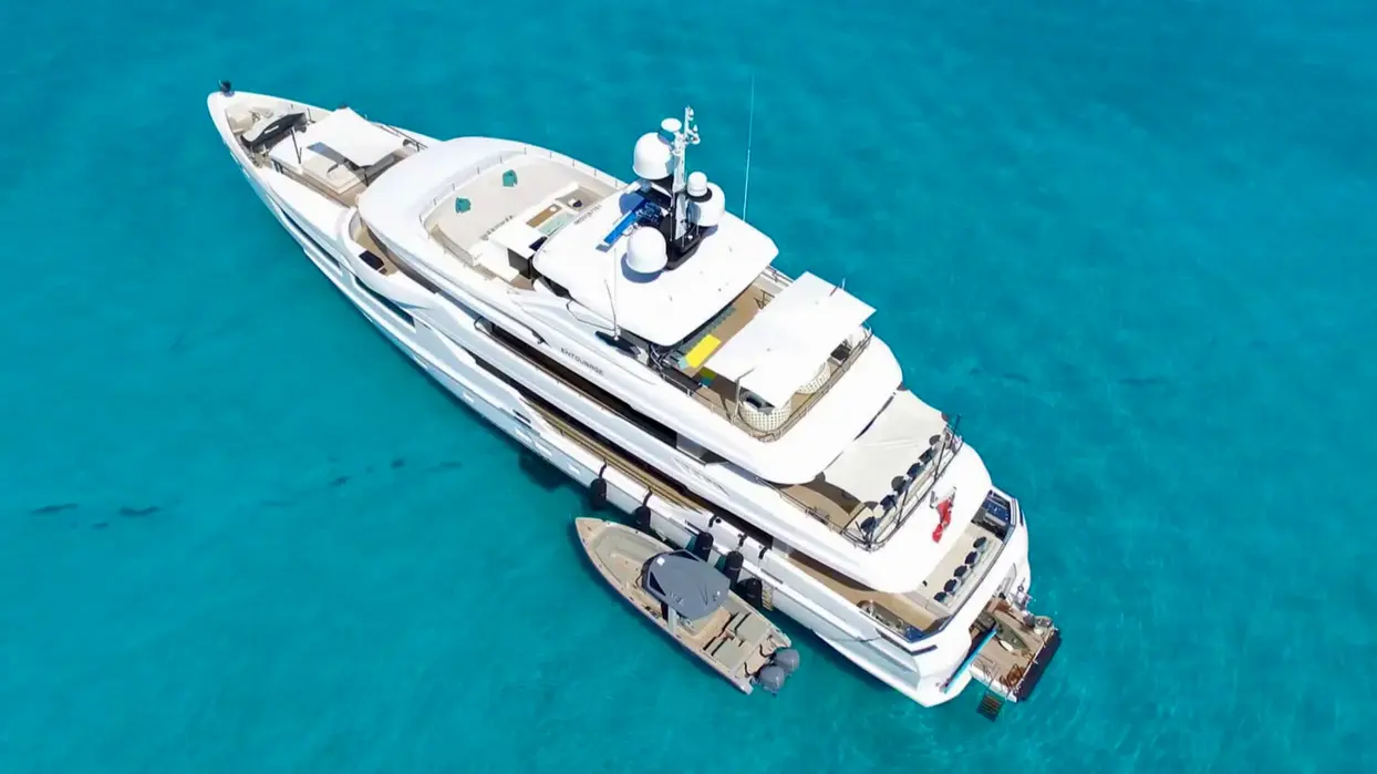 Side angle of Amels Entourage showing sleek profile and decks.