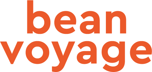 Bean voyage logo in bold orange text. Logo is vertically oriented with bean on one line and voyage on the second line.  