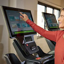 Precor_Facility_P94_700_TRM_Console_Close_Up_with_Person_Engaging_with_Media_edited.jpg