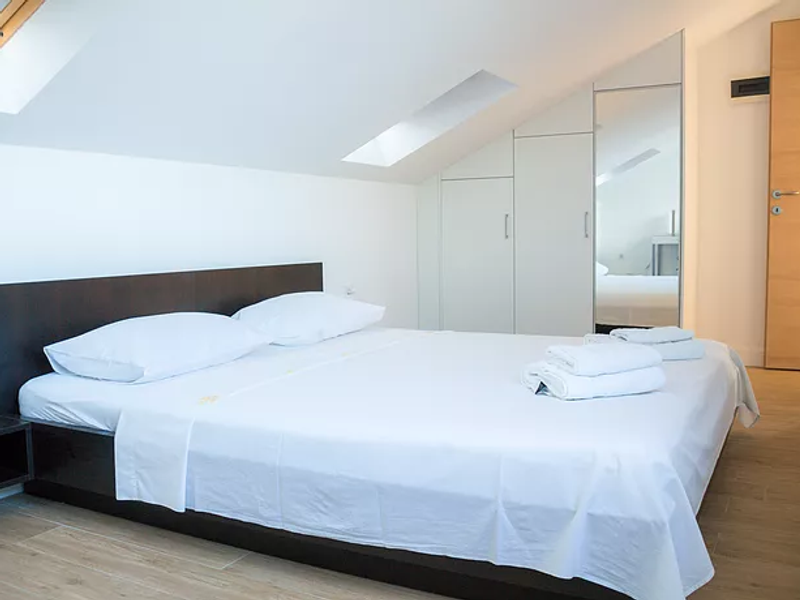 Loft bedroom at Villa Gabrijela on the top floor with roof terrace access, Korčula island