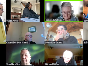 Video call with nine participants in home offices. Some are writing or listening. Visible names include Sandra, Edwin, and John.