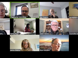 A virtual meeting grid with 10 participants, each in separate rooms. Visible names and various backgrounds; one includes a fish sculpture.