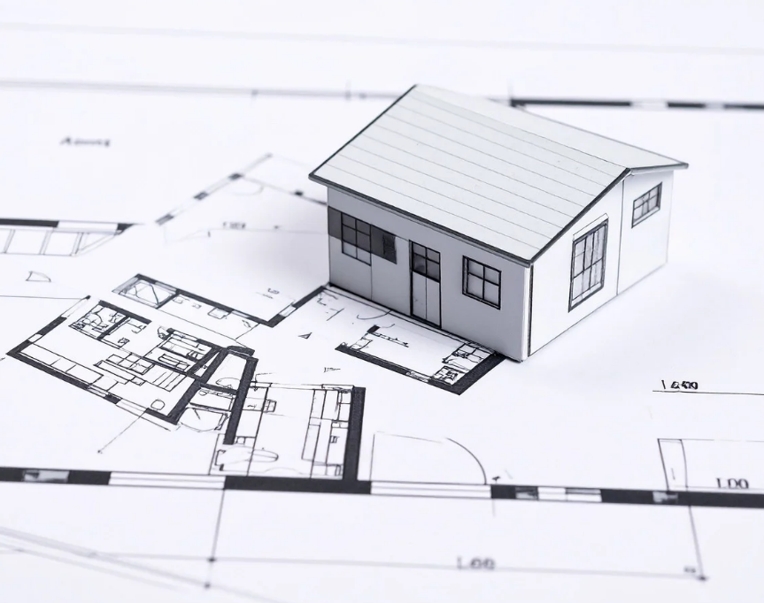 Model house on detailed architectural blueprints. The setting is minimalist, with monochrome tones and precise lines, conveying precision.