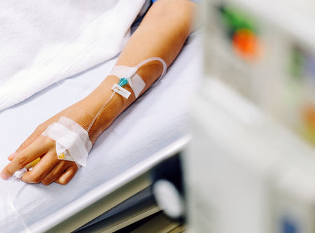 Close up image of IV drip in patient's h