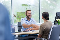 Hispanic man getting a loan at the bank