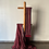 Thumbnail: maroon colored mul saree with zari stripes draped on a saree stand