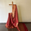 Thumbnail: maroon colored banarasi soft silk saree draped on a saree stand