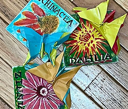 Hand painted flowers on canvas with my son's origami butterflies affixed to the flowers' surfaces.