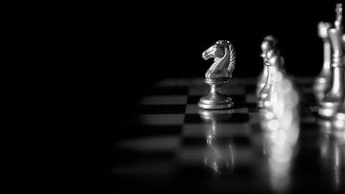 game of chess with knight slightly ahead