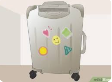 Placer un signe sur ma valise pour l'identifier facilement - Par Julie BCantin